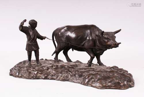 A GOOD JAPANESE BRONZE OKIMONO OF AN OXEN AND ATTENDANT, the attendant holding the oxen on a lead