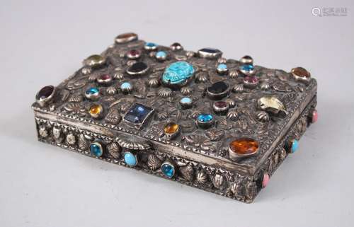 A GOOD INDIAN RECTANGULAR SILVER BOX AND COVER inset with coloured stones, 16cm long x 11.5cm deep x