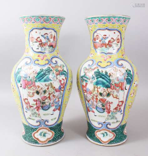 A PAIR OF 19TH CENTURY CHINESE FAMILLE JAUNE PORCELAIN VASES, each vase with double panels decorated