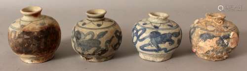 A GROUP OF FOUR SIMILAR CHINESE WANLI PERIOD SHIPWRECK BLUE & WHITE PORCELAIN JARS, one encrusted