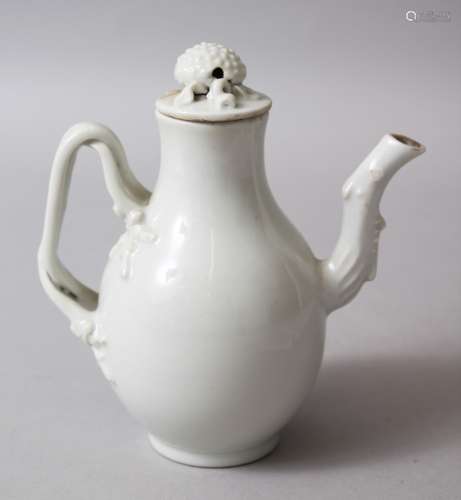 AN 18TH / 19TH CENTURY CHINESE EXPORT WHITE PORCELAIN JUG, the handle moulded in vine form, the
