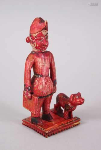 A RARE 18TH-19TH CENTURY INDIAN POLYCHROME IVORY FIGURE OF A MAN carrying a Union flag, a dog by his