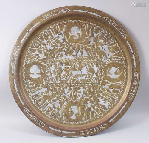 A CAIRO BRASS INLAID CIRCULAR PLAQUE decorated with figures and horses, 60cm diameter.