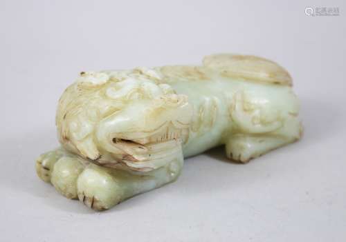 A GOOD 19TH / 20TH CENTURY CHINESE CARVED JADE LION DOG, the dog recumbent, 5.5cm high x 16cm wide.
