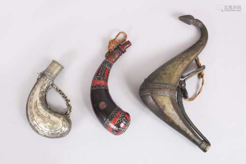 A COLLECTION OF THREE SMALL ISLAMIC POWDER HORNS, 17cm x 10cm long.