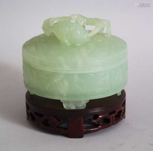 A 20TH CENTURY CHINESE JADE CYLINDRICAL POT AND COVER, the pot with four scroll feet, chased