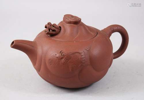 A CHINESE 20TH CENTURY CHINESE YIXING CLAY TEAPOT, with moulded panels of mythical beasts, the lid