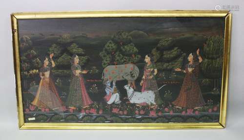 A 19TH-20TH CENTURY FRAMED INDIAN PAINTING ON TEXTILE depicting a blue skin god milking a cow with