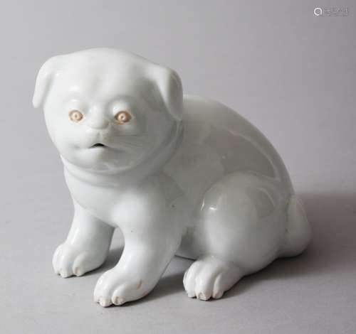 A JAPANESE MEIJI PERIOD HIRADO PORCELAIN MODEL OF AN AKITA PUPPY, modeled in a seated position, 10cm