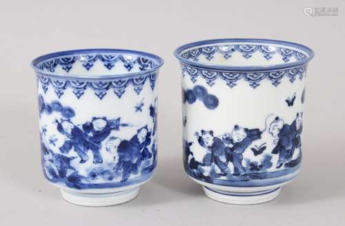 A GOOD PAIR OF JAPANESE MEIJI PERIOD BLUE & WHITE PORCELAIN BEAKERS / CUPS, the decoration of boys