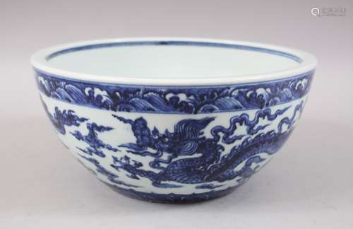 A CHINESE BLUE AND WHITE PORCELAIN DRAGON BOWL, the interior centre with a six-character Xuande