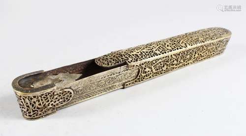 A 19TH-20TH CENTURY PERSIAN QAJAR QALAMDAN OPEN WORK BRASS PEN BOX with inkwell, 22cm long.