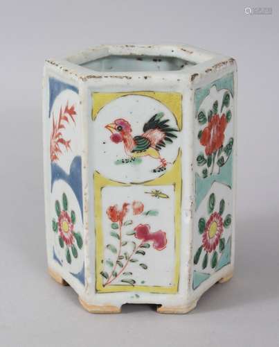 AN 18TH / 19TH CENTURY CHINESE FAMILLE ROSE HEXAGONAL PORCELAIN BRUSH POT, the body bearing six