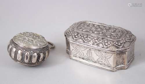 TWO 19TH CENTURY SOUTH EAST ASIAN SILVER BOXES, 9cm long x 5cm diameter.