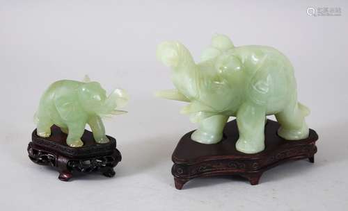 TWO 20TH CENTURY CHINESE JADE ELEPHANT FIGURES WITH BASES, each elephant in a striding pose and