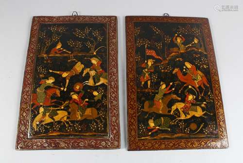 A PAIR OF 19TH CENTURY QAJAR HAND PAINTED BOOK COVERS, deer hunting, 26cm x 19cm.