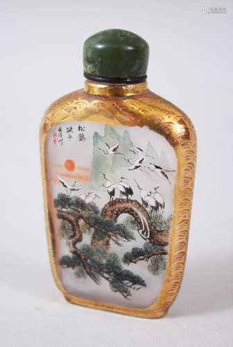 A CHINESE 20TH CENTURY REPUBLIC REVERSE PAINTED GLASS SNUFF BOTTLE, the painting depicting scenes of