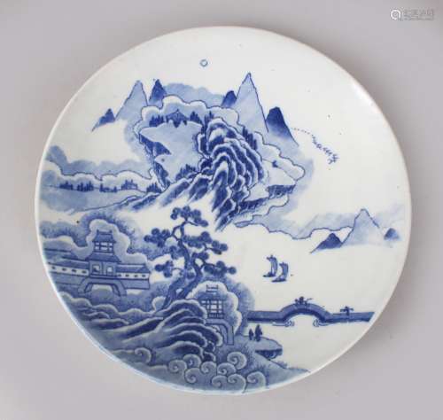 A 20TH CENTURY CHINESE BLUE & WHITE PORCELAIN PLATE, depicting scenes of landscape scenes, 21.5cm
