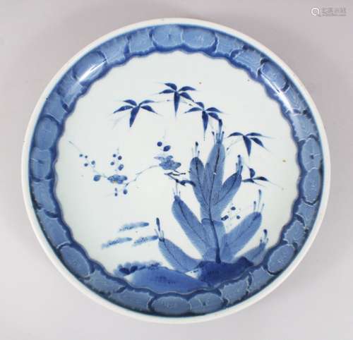 A JAPANESE MEIJI PERIOD BLUE & WHITE ARITA PORCELAIN DISH, decorated with scenes of foliage, the