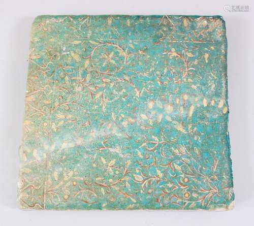 A RARE 12TH-13TH CENTURY PERSIAN GREEN GLAZED SQUARE TILE with leaf decoration, 23cm x 23cm.