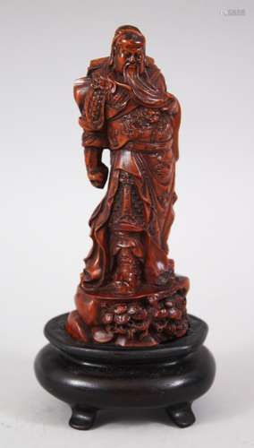 A JAPANESE MEIJI PERIOD BOXWOOD OKIMONO OF A SAMURAI WARRIOR, the body finely carved to show details