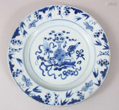 A CHINESE BLUE & WHITE KANGXI PORCELAIN PLATE, decorated with floral displays and implements, 23cm