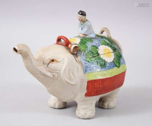 A JAPANESE BANKO ELEPHANT & MAN CERAMIC TEAPOT , the lid formed of a man seated upon oriental rug