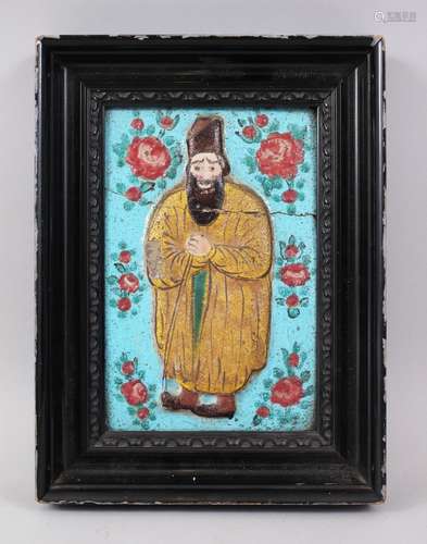 A 19TH CENTURY PERSIAN QAJAR POTTERY TILE of a bearded man, turquoise ground with roses, 21cm x