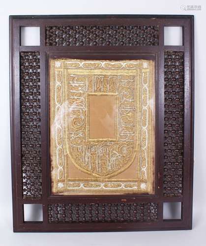 A 19TH CENTURY ISLAMIC OTTOMAN MIHRAB SHAPED TEXTILE PANEL with gilt metal wire embroidery in its