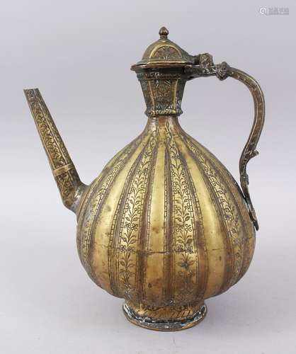 AN 18TH-19TH CENTURY INDIAN BRASS EWER, 28cm high.