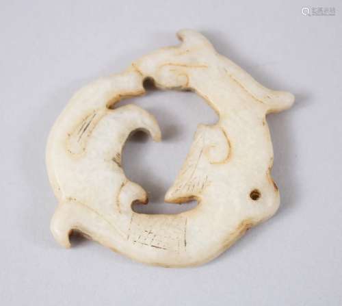 A 19TH / 20TH CENTURY CHINESE CARVED JADE PENDANT OF A DRAGON, 4.6cm diameter.