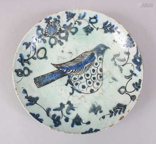 A 17TH CENTURY IZNIK POTTERY DISH - Ottoman Turkey, pale blue ground with polychrome decoration