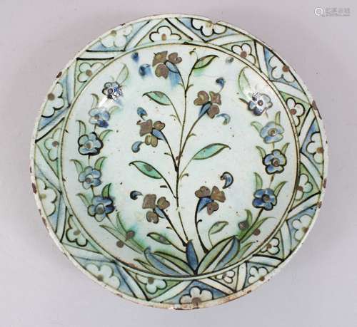 A 17TH CENTURY IZNIK POTTERY DISH - Ottoman Turkey, pale blue ground with polychrome decoration of