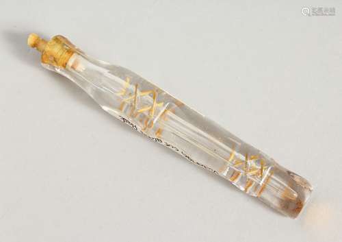 A 19TH CENTURY GILDED GLASS TAPERING SCENT BOTTLE AND STOPPER. 11.5cms long.