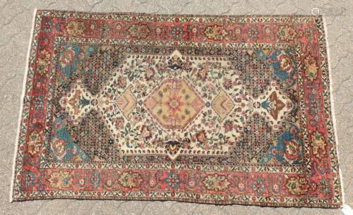 A FINE ANTIQUE SHAH ASHRAFI BAKHTIARI PERSIAN RUG with an allover patterb, central motif and smaller