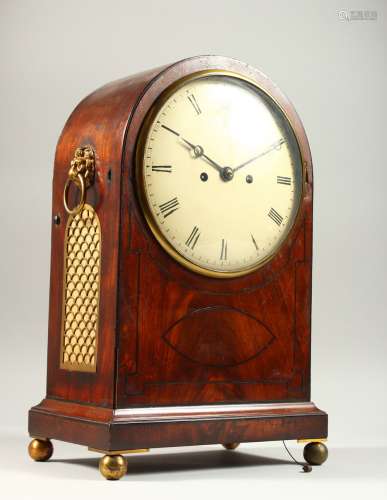 A REGENCY MAHOGANY BRACKET CLOCK, with domed top, brass grilled sides, lion ring handle, eight-day