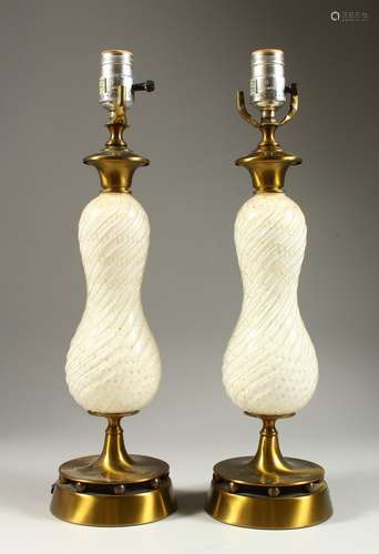 A GOOD PAIR OF MURANO GLASS LAMPS converted to electricity, on circular bases. 1ft 6ins high.