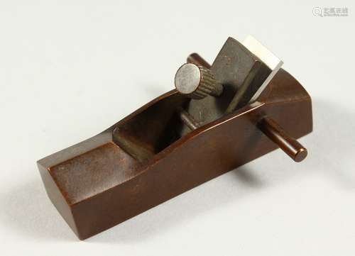 A MINIATURE BRONZE WOODWORKING PLANE. 3.5ins long.