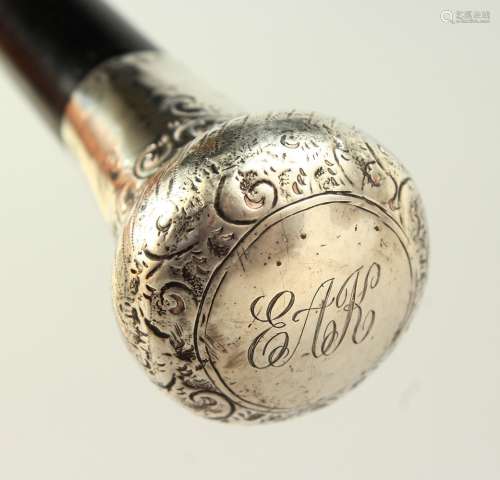 AN EARLY 20TH CENTURY WALKING STICK with engraved silver handle. 95cms long.