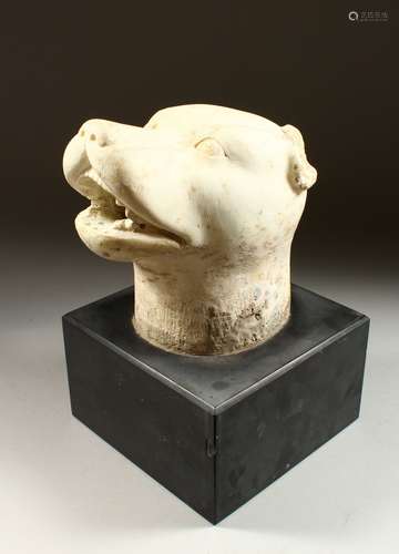 AFTER THE ANTIQUE, A CARVED ALABASTER HEAD OF A DOG, its mouth wide open, mounted on a later black