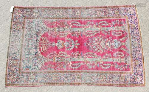 AN ANTIQUE PERSIAN KASHAN SILK RUG with floral design on a red ground. 6ft 2ins x 4ft 1in.
