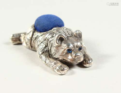 A NOVELTY SILVER BEAR PIN CUSHION. 5cms long.