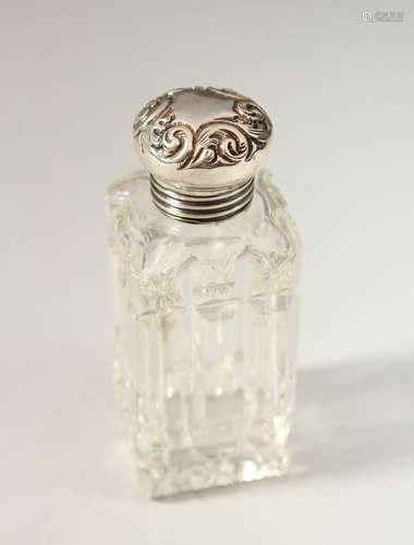 A SMALL VICTORIAN SQUARE CUT GLASS SCENT BOTTLE with screw off silver top. 6.5cms long x 2.5cms