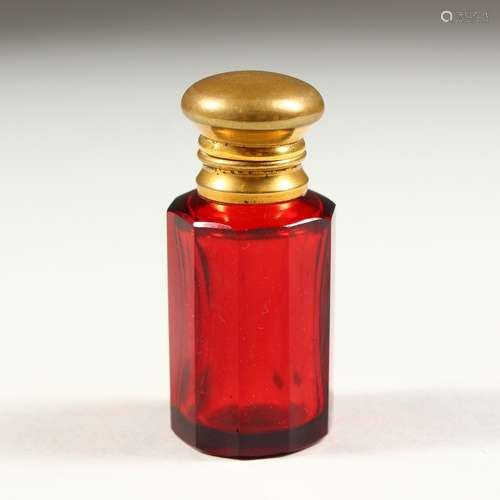 A SMALL VICTORIAN RUBY GLASS SCENT BOTTLE AND STOPPER. 5.5cms high.