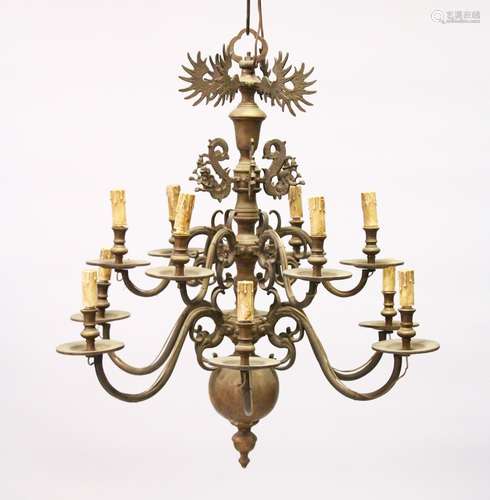 A GOOD DUTCH BRASS TWO TIER CHANDELIER with twelve scrolling branches. 2ft 6ins high x 2ft wide.