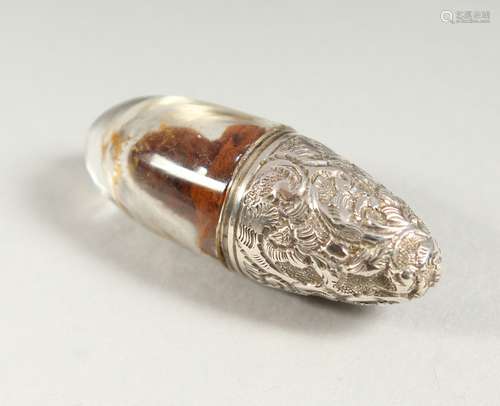 A VICTORIAN GLASS AND REPOUSSE SILVER BULLET SHAPED SCENT BOTTLE .