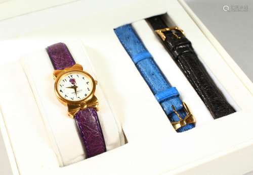 AN 18CT GOLD NINA RICCI WRISTWATCH with leather strap, in original box.