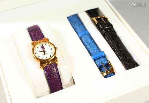 AN 18CT GOLD NINA RICCI WRISTWATCH with leather strap, in original box.