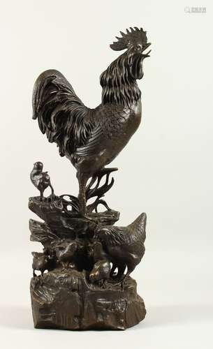 AFTER A. CAIN A LARGE BRONZE ROOSTER, HEN AND CHICKS. Signed A. CAIN. 53cms high.