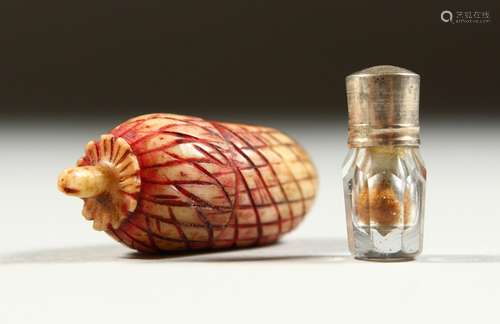 A TINY ACORN SHAPED SCREW OPENING CASE enclosing a glass scent bottle and stopper. 3cms long.